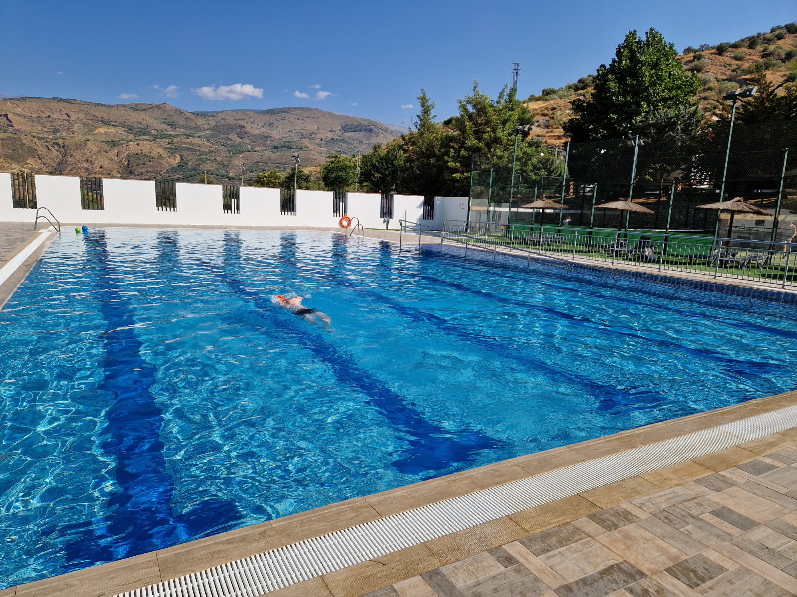 Torvizcón village public swimming pool with mountain views, Alpujarra Spain.