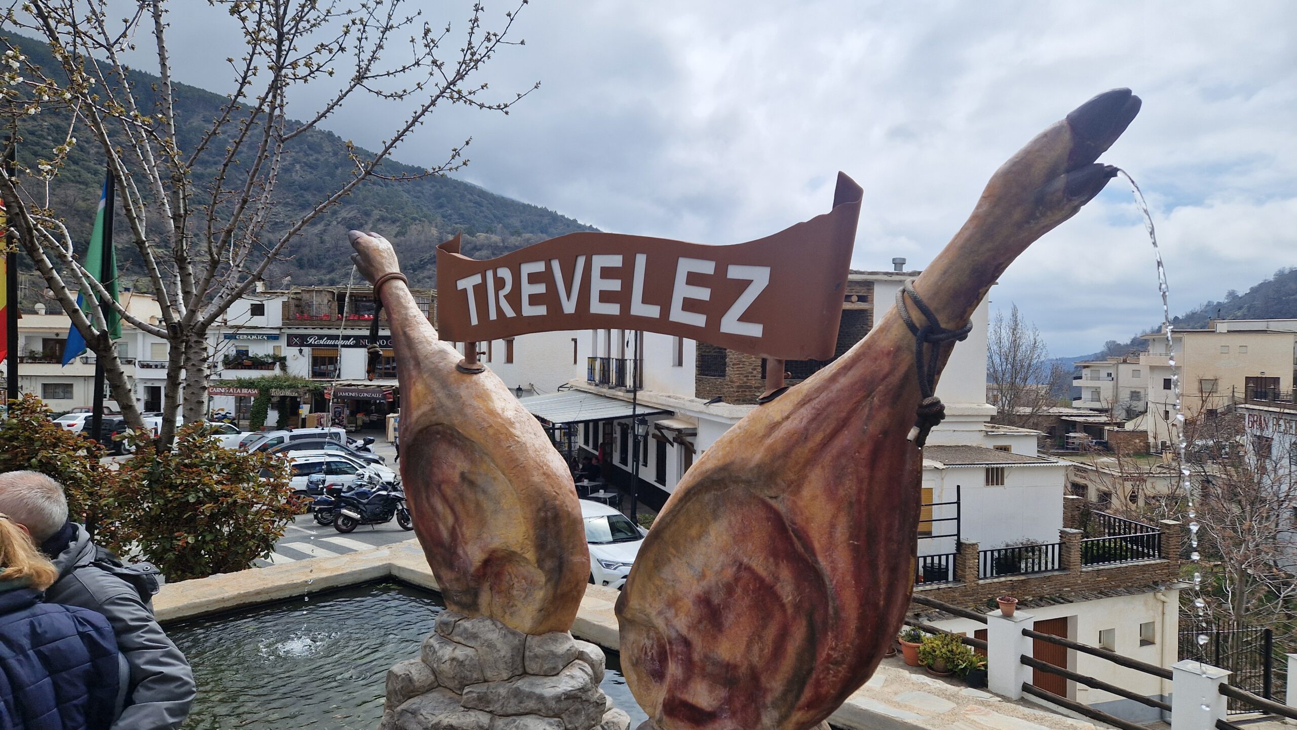 Panoramic view of Trevélez, one of Spain’s highest Alpujarras villages, with whitewashed houses and Sierra Nevada mountains.